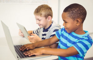 kids using a laptop and digital tablet